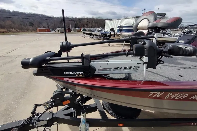 Slide: The Image of 2020 Vexus AVX 1980 boat with Minn Kota Ultrex trolling motor in parking lot. - 2