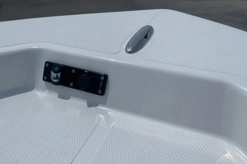 Slide: The Image of 2023 BlackJack 256 Bay boat deck with control panel and textured surface. - 20