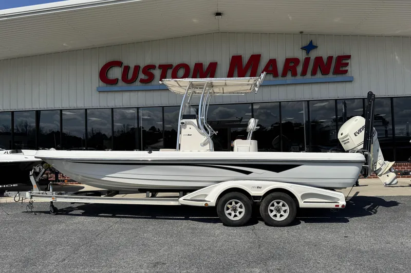 The Image of 2012 Ranger 2410 Bay Ranger boat on trailer at Custom Marine dealership. - 0