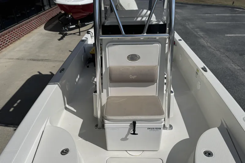 Slide: The Image of 2012 Ranger 2410 Bay Ranger boat interior with seating and storage. - 12