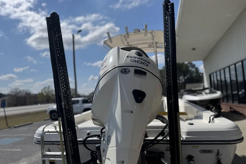 Slide: The Image of 2012 Ranger 2410 Bay Ranger with Evinrude 300 engine, parked outdoors. - 4