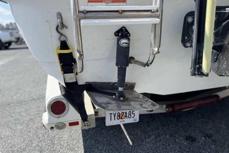 Slide: The Image of 2012 Ranger 2410 Bay Ranger boat stern with Lenco trim tab and ladder. - 5