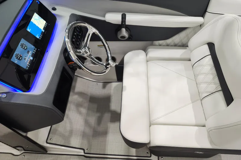 Slide: The Image of Luxurious 2025 Regal LX2 boat interior with modern dashboard and plush seating. - 14