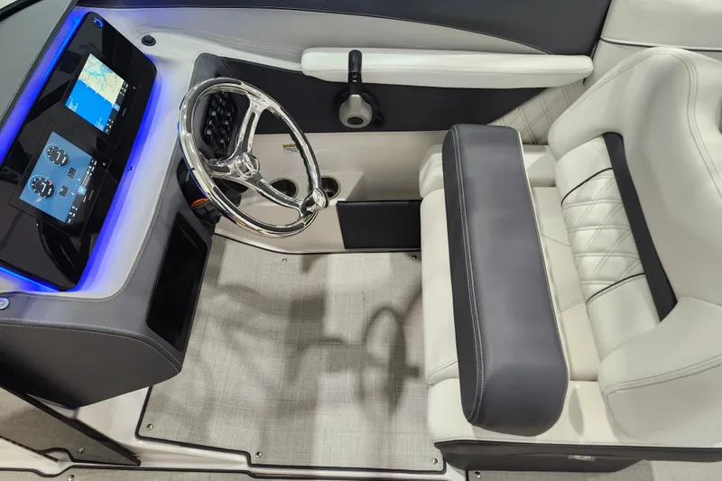 Slide: The Image of 2025 Regal LX2 boat interior with modern dashboard, touchscreen display, and luxurious seating. - 15