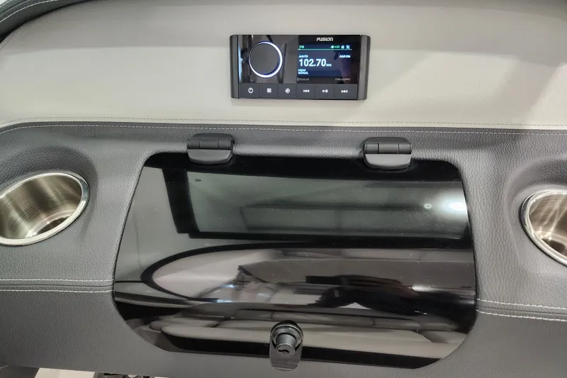 Slide: The Image of 2025 Regal LX2 dashboard with Fusion stereo and cup holders. - 18