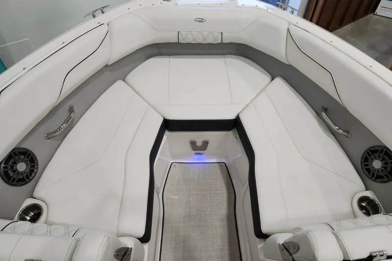 Slide: The Image of Luxurious interior of 2025 Regal LX2 boat with white seating and modern design. - 19