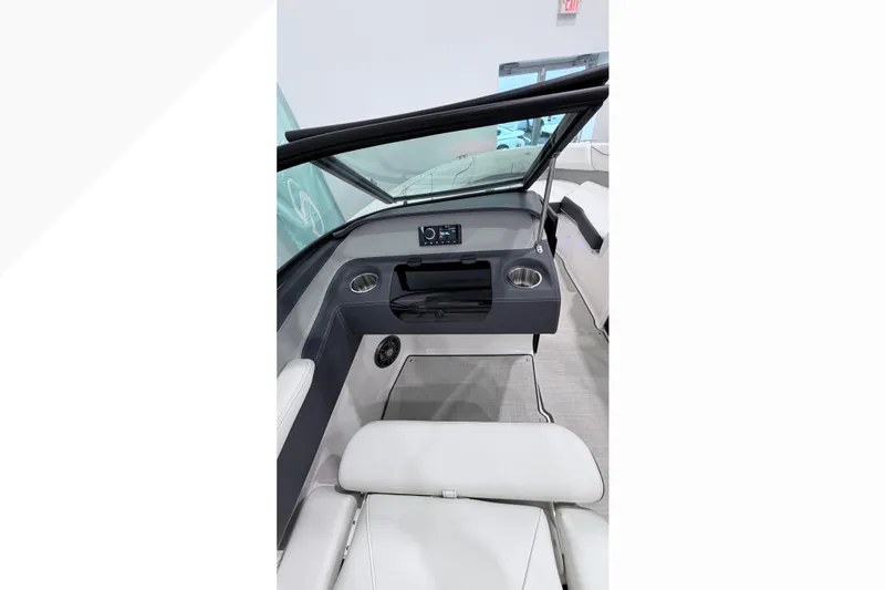 Slide: The Image of Interior of 2025 Regal LX2 boat with modern dashboard and seating. - 2