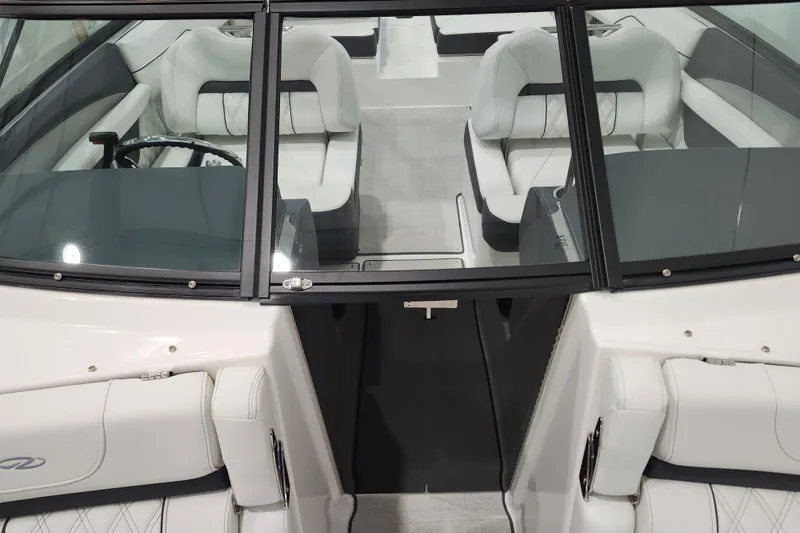 Slide: The Image of 2025 Regal LX2 boat interior with white leather seating and sleek design. - 23