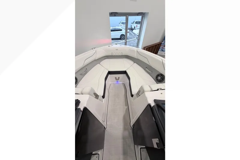 Slide: The Image of 2025 Regal LX2 boat interior with white seating and modern design. - 3