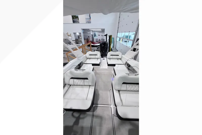 Slide: The Image of Luxurious interior of 2025 Regal LX2 boat with plush white seating. - 4