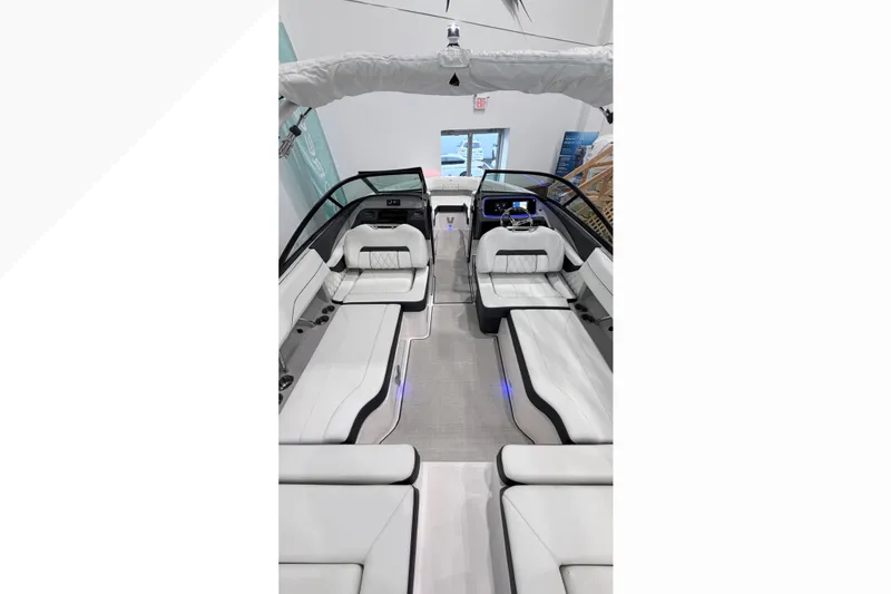 Slide: The Image of Luxurious interior of 2025 Regal LX2 boat with sleek white seating and modern design. - 6