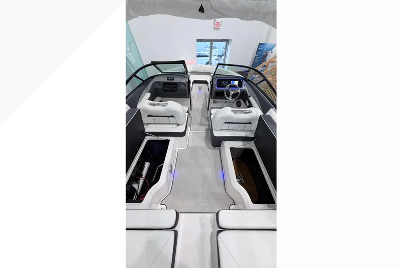 Slide: The Image of Interior view of 2025 Regal LX2 boat showcasing modern seating and dashboard design. - 8