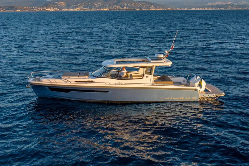 Slide: The Image of Manufacturer Provided Image: Nimbus Weekender 11 2026 on open sea at sunset. - 3