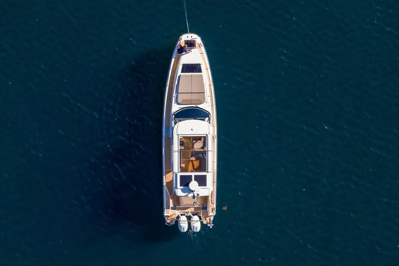 Slide: The Image of Manufacturer Provided Image: Aerial view of Nimbus Weekender 11 yacht, 2026 model, on open water. - 6