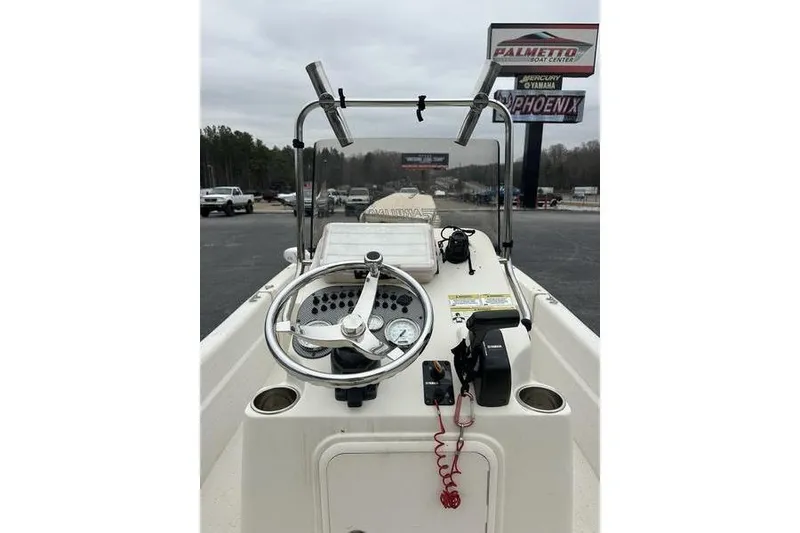 Slide: The Image of 2014 Carolina Skiff JV Series 17 SS/TH/CC boat console with steering wheel and controls. - 4