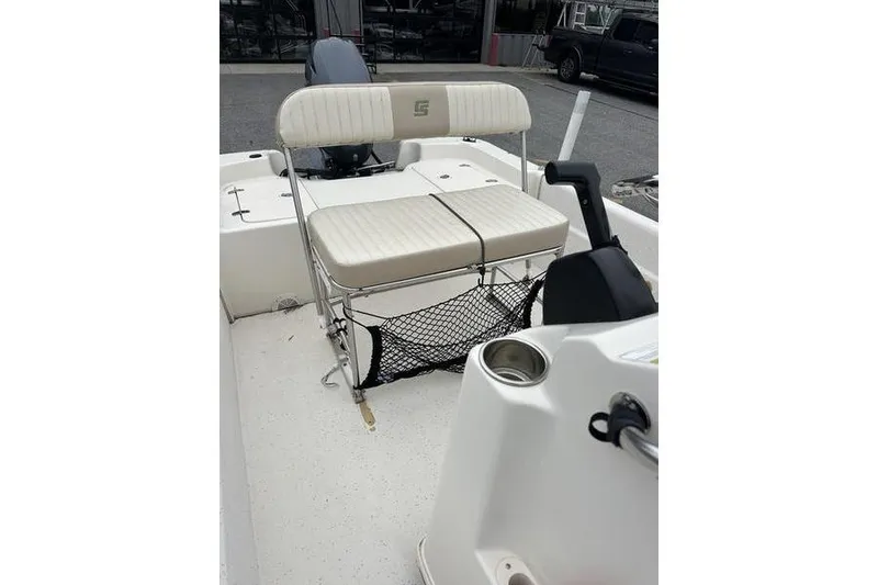 Slide: The Image of 2014 Carolina Skiff JV Series 17 SS/TH/CC boat interior with seating and controls. - 9