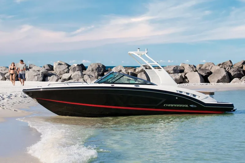 The Image of Manufacturer Provided Image: 2017 Chaparral 227 SSX boat docked on a sandy beach with rocks. - 0