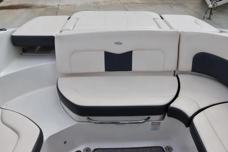 Slide: The Image of 2017 Chaparral 227 SSX boat interior with white and black seating arrangement. - 14
