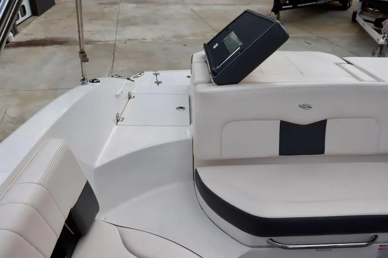 Slide: The Image of 2017 Chaparral 227 SSX boat interior with white seating and dashboard. - 15