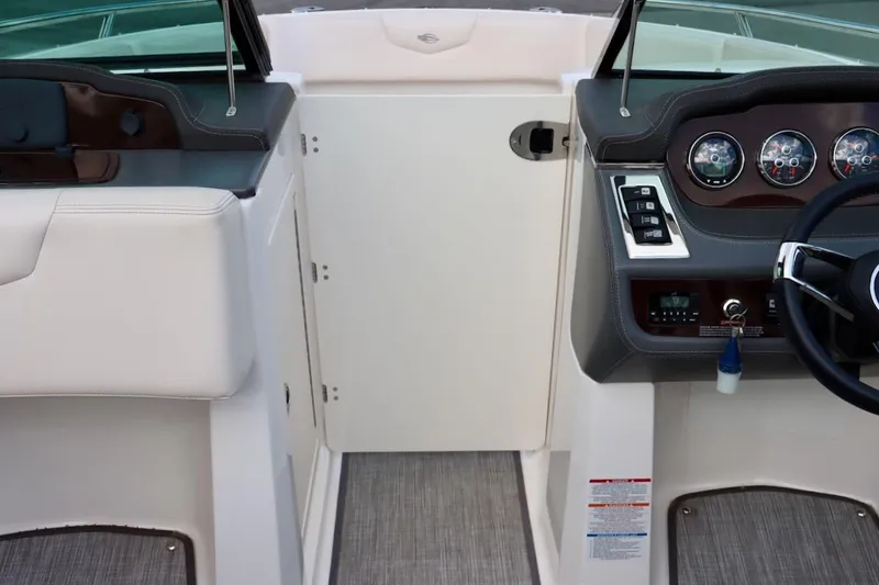Slide: The Image of 2017 Chaparral 227 SSX boat interior with dashboard and steering wheel. - 22
