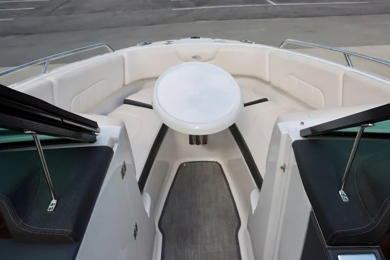 Slide: The Image of 2017 Chaparral 227 SSX boat interior with seating and table in bow area. - 25