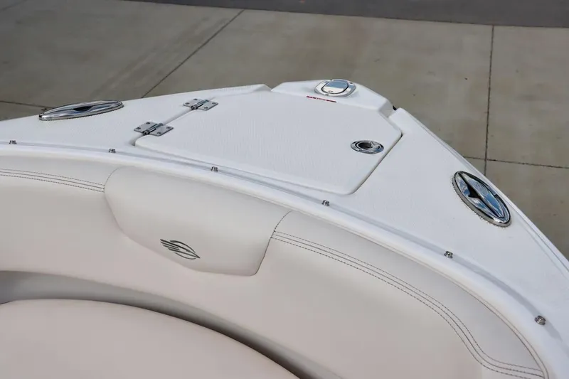 Slide: The Image of 2017 Chaparral 227 SSX boat bow with white seating and storage compartments. - 28