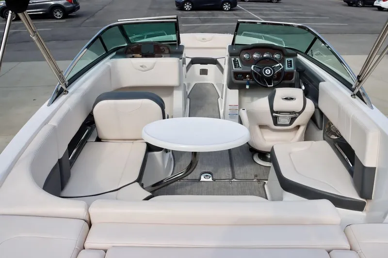 Slide: The Image of 2017 Chaparral 227 SSX boat interior with white seating and steering console. - 29