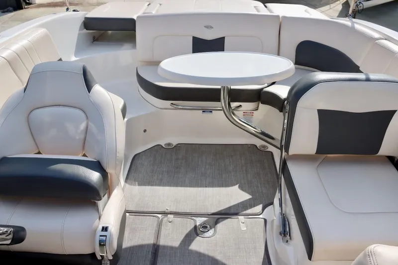 Slide: The Image of 2017 Chaparral 227 SSX boat interior with seating and a round table. - 31