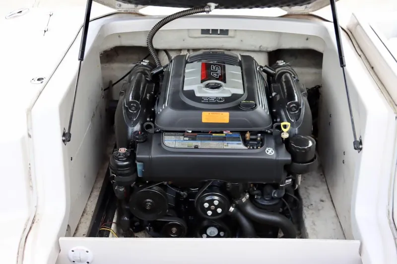 Slide: The Image of Engine compartment of a 2017 Chaparral 227 SSX boat, showcasing a powerful motor. - 33