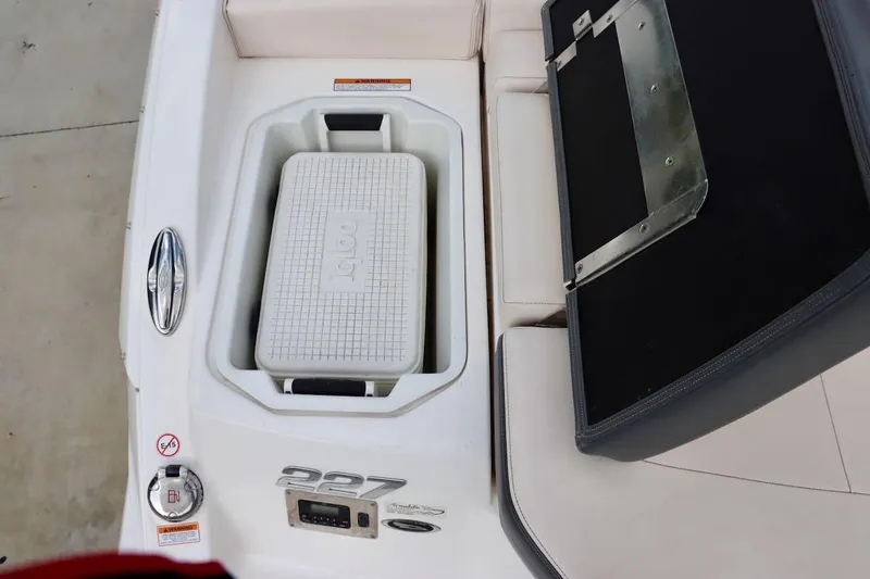 Slide: The Image of 2017 Chaparral 227 SSX boat interior with Igloo cooler and seating area. - 35