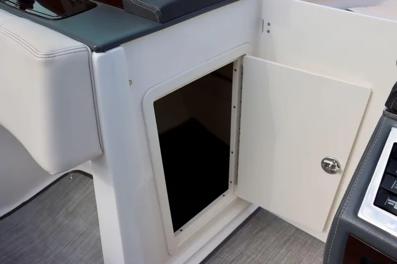 Slide: The Image of Open storage compartment on 2017 Chaparral 227 SSX boat interior. - 37