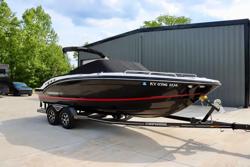 Slide: The Image of 2017 Chaparral 227 SSX boat on trailer, parked outdoors near a building. - 41