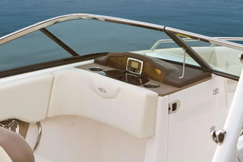 Slide: The Image of Manufacturer Provided Image: 2017 Chaparral 227 SSX boat dashboard with navigation system and cup holders. - 6