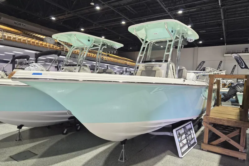 The Image of 2026 Key West 239 FS boat displayed indoors, featuring a sleek design and light blue hull. - 0
