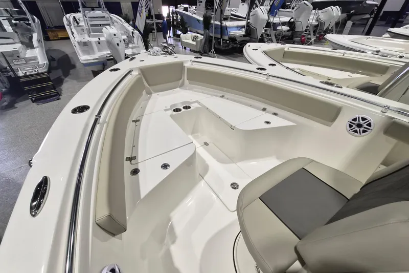 Slide: The Image of 2026 Key West 239 FS boat interior with seating and storage compartments. - 11