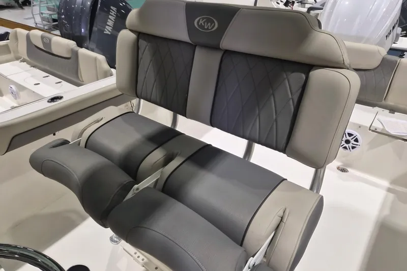 Slide: The Image of 2026 Key West 239 FS boat interior with cushioned seating and modern design. - 4