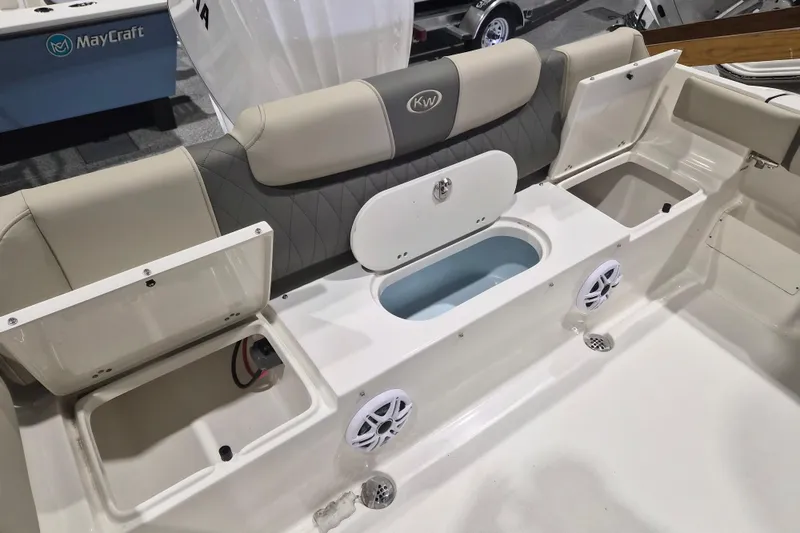 Slide: The Image of 2026 Key West 239 FS boat interior with storage compartments and speakers. - 7