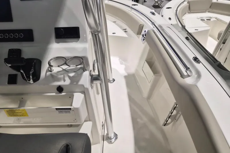 Slide: The Image of 2026 Key West 239 FS boat interior with control panel and seating area. - 8