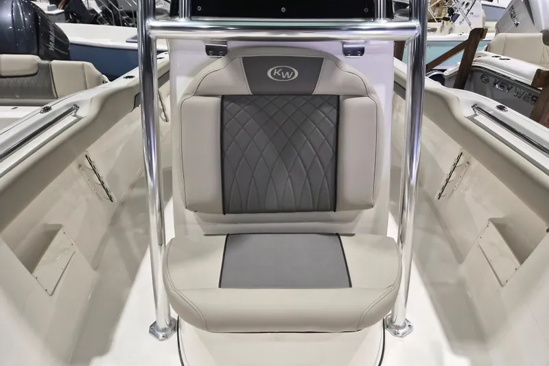 Slide: The Image of 2026 Key West 239 FS boat interior with cushioned seating and stainless steel frame. - 9
