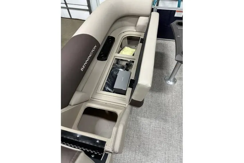 Slide: The Image of 2026 Bennington 21 SSR Quad Bench interior storage compartments, showcasing spacious seating and storage solutions. - 16