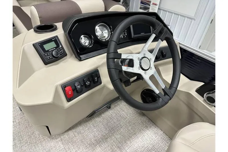 Slide: The Image of 2026 Bennington 21 SSR Quad Bench boat dashboard with steering wheel and controls. - 18