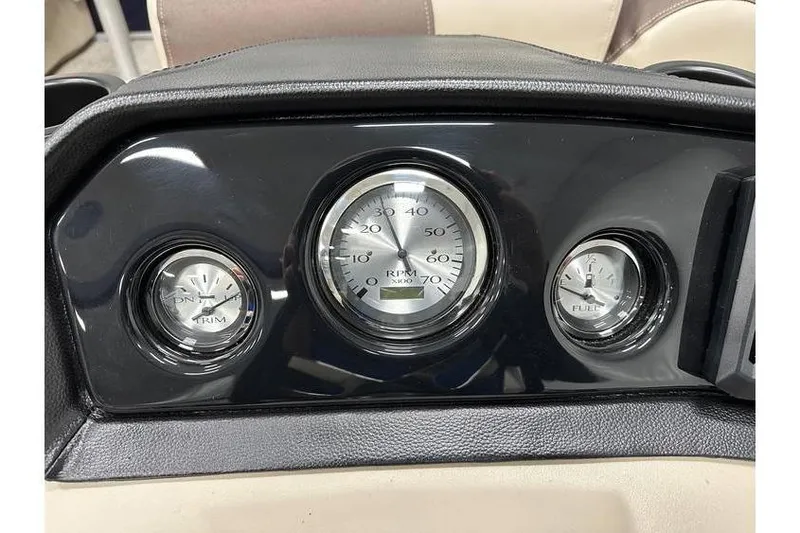 Slide: The Image of Dashboard of 2026 Bennington 21 SSR Quad Bench with RPM, trim, and fuel gauges. - 20