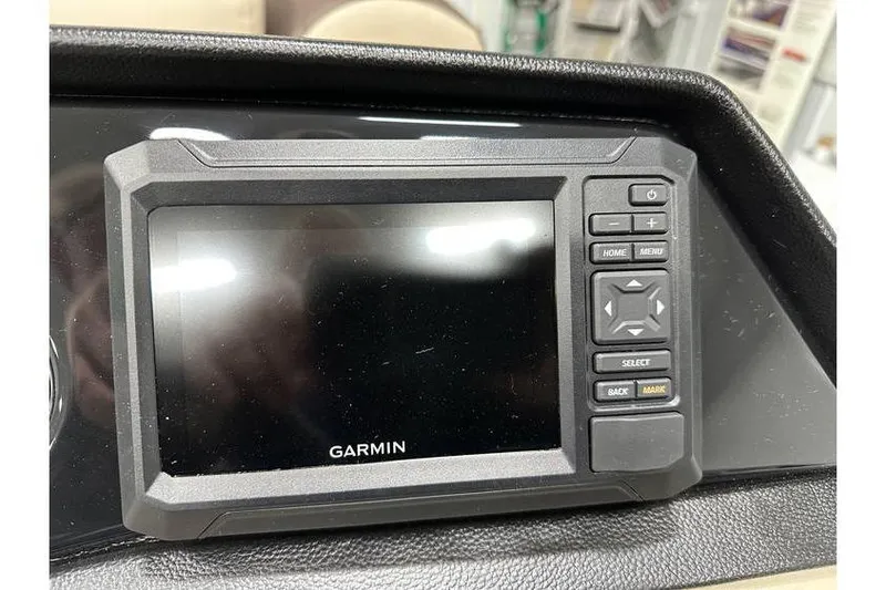 Slide: The Image of Garmin display on 2026 Bennington 21 SSR Quad Bench boat dashboard. - 21