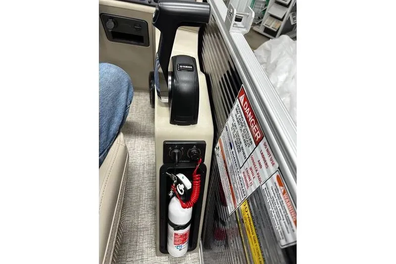 Slide: The Image of 2026 Bennington 21 SSR Quad Bench boat console with Yamaha throttle and safety equipment. - 23