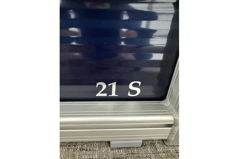 Slide: The Image of 2026 Bennington 21 SSR Quad Bench, model detail with '21 S' marking. - 3