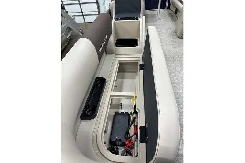 Slide: The Image of 2026 Bennington 21 SSR Quad Bench interior with open storage compartment. - 30