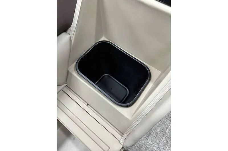 Slide: The Image of 2026 Bennington 21 SSR Quad Bench interior storage compartment detail. - 31