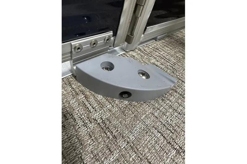 Slide: The Image of Close-up of a Bennington 21 SSR Quad Bench 2026 boat hinge detail. - 33