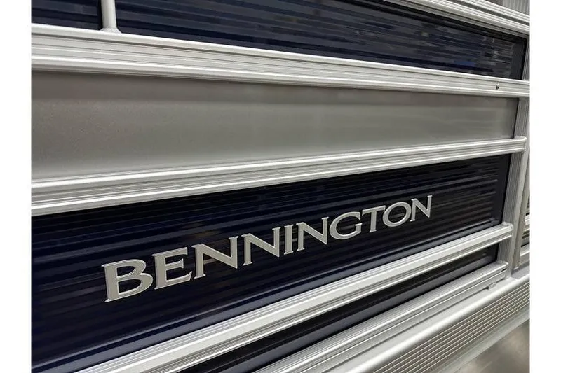 Slide: The Image of Close-up of 2026 Bennington 21 SSR Quad Bench boat exterior with logo. - 5