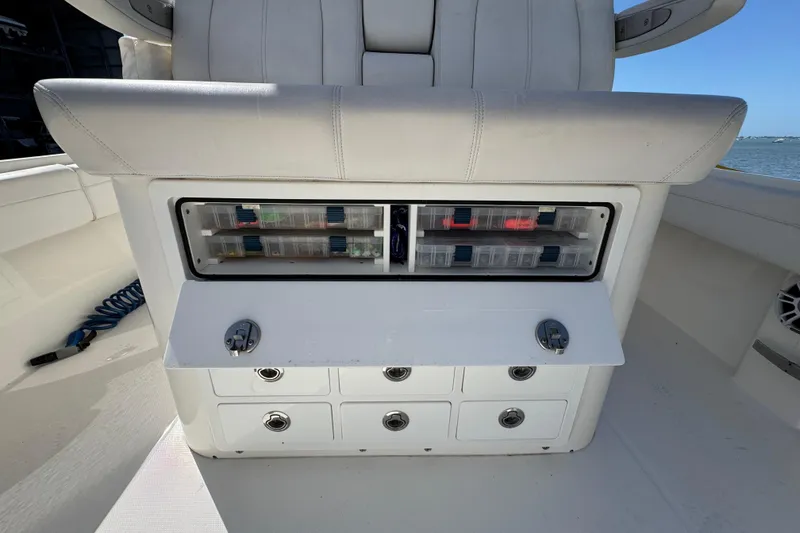 Slide: The Image of 2023 Regulator 31 boat storage compartment with tackle boxes and drawers. - 10